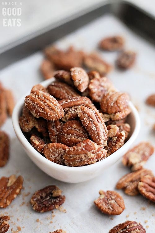 small white bowl of sugared pecans 